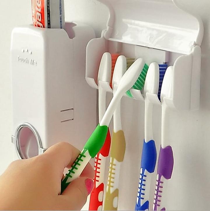 TOOTHPASTE DISPENSER WITH TOOTHBRUSH HOLDER